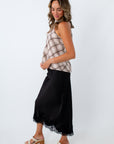 Elegant black midi skirt for game day, black skirt for game day, black satin skirt, USC game day outfit inspo