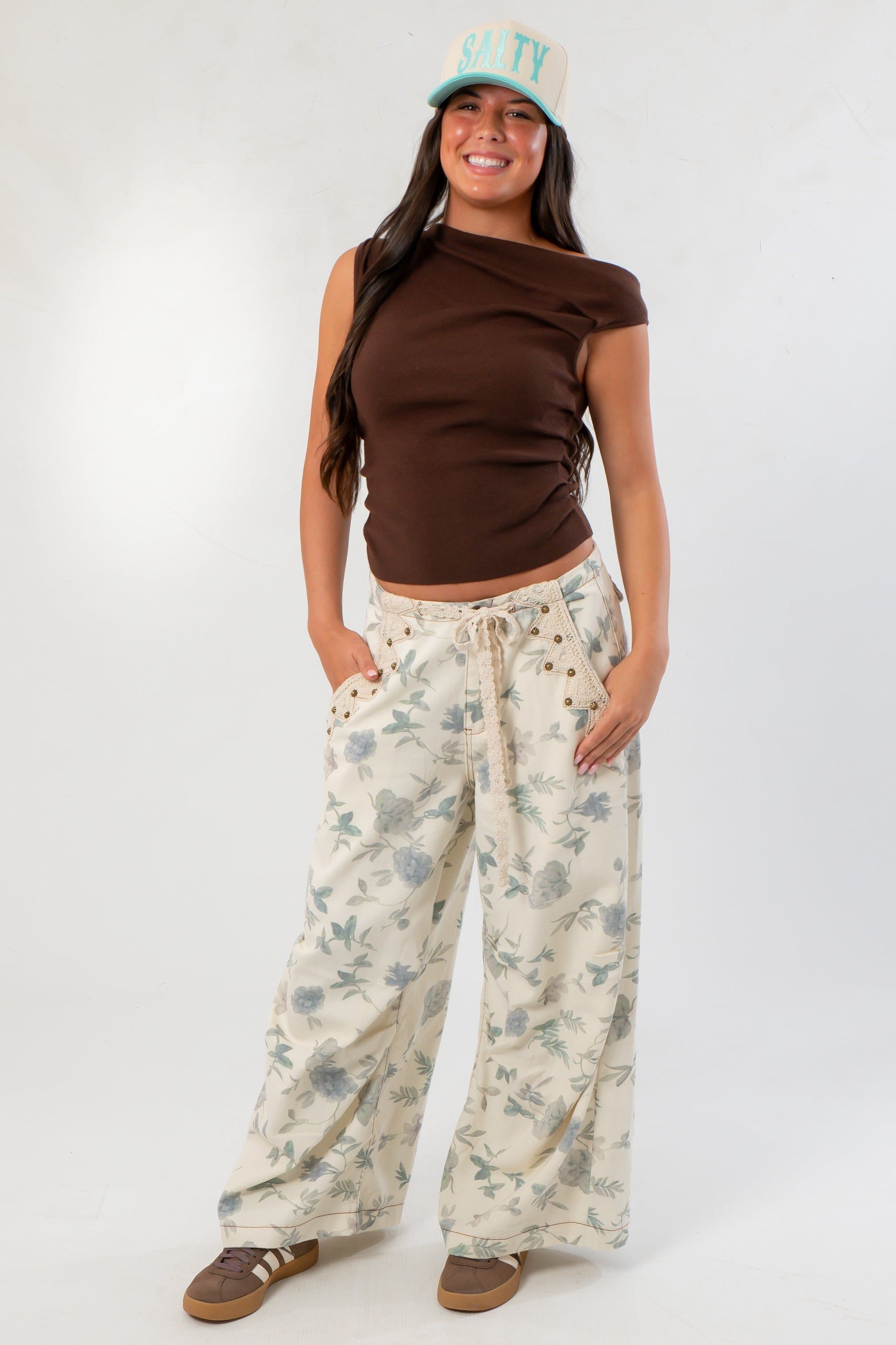 Friday Feeling Brown Asymmetrical Top paired with floral wide-leg pants, a trendy and comfortable fall essential.