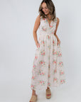 Back view of Spring Soirée White Floral Midi Dress with bow tie detail