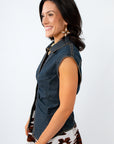Woman wearing a denim top with a queen of sparkles skirt