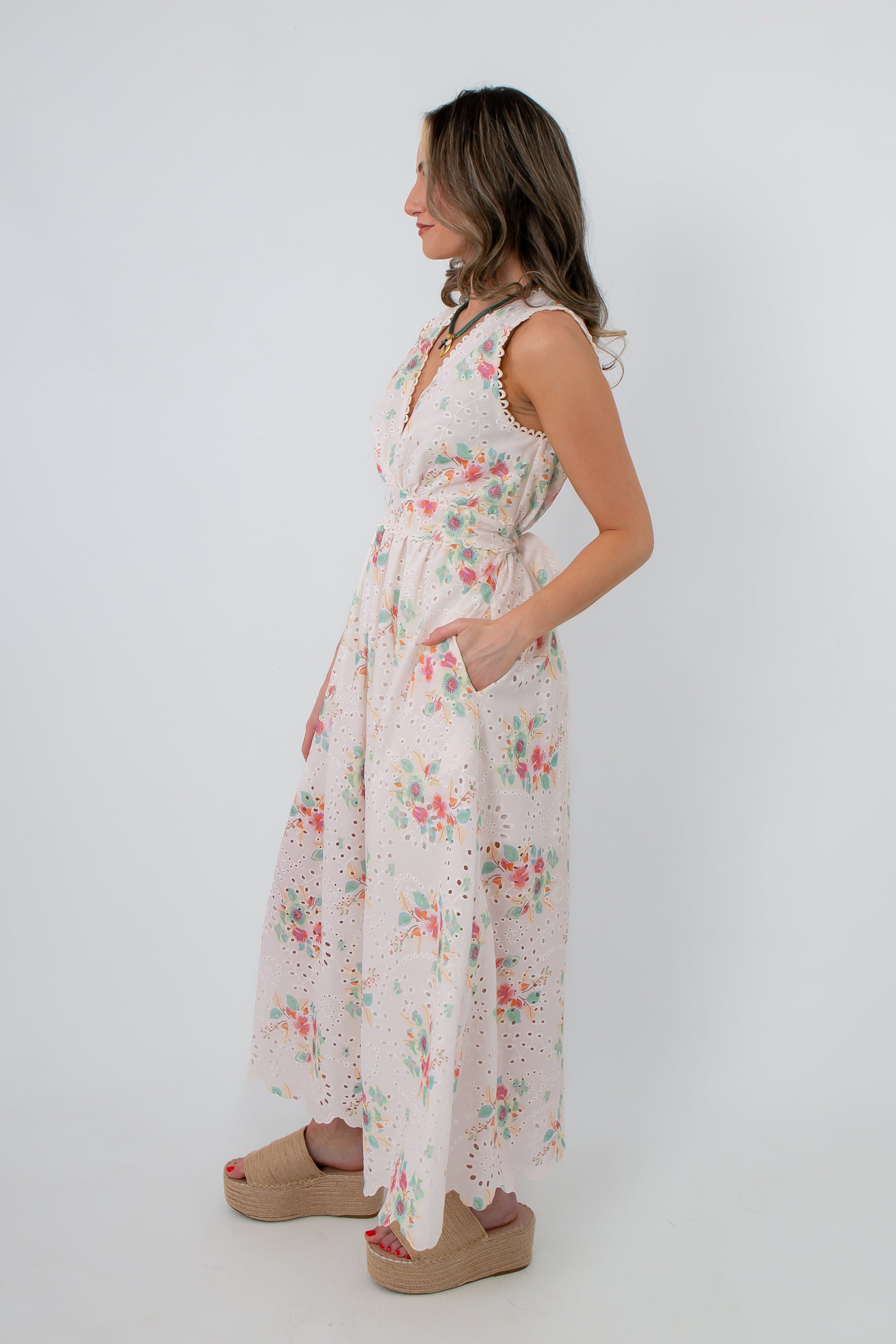 Rear view of Spring Soirée White Floral Midi Dress showing back zipper and floral design