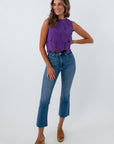 bright purple floral lace crochet overlay top with orange and gold accessories