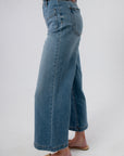 Back view of wide leg denim jeans with patch pockets