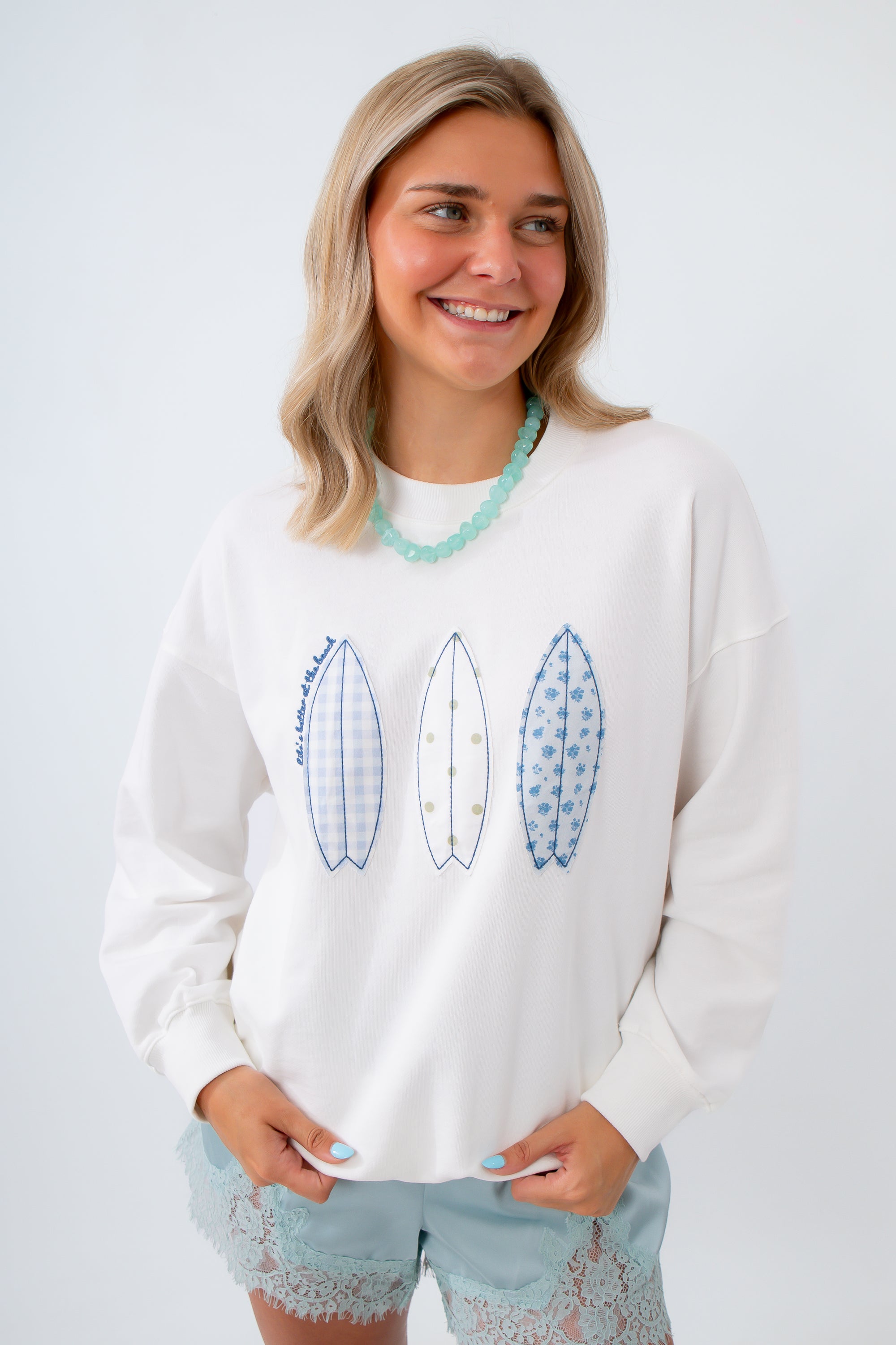 surfboard pacthes sweatshirt with life is better at the beach printed