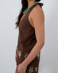 Woman wearing Beachcomber Chocolate Brown Embroidered Halter Top with turquoise beaded necklace, stylish summer outfit
