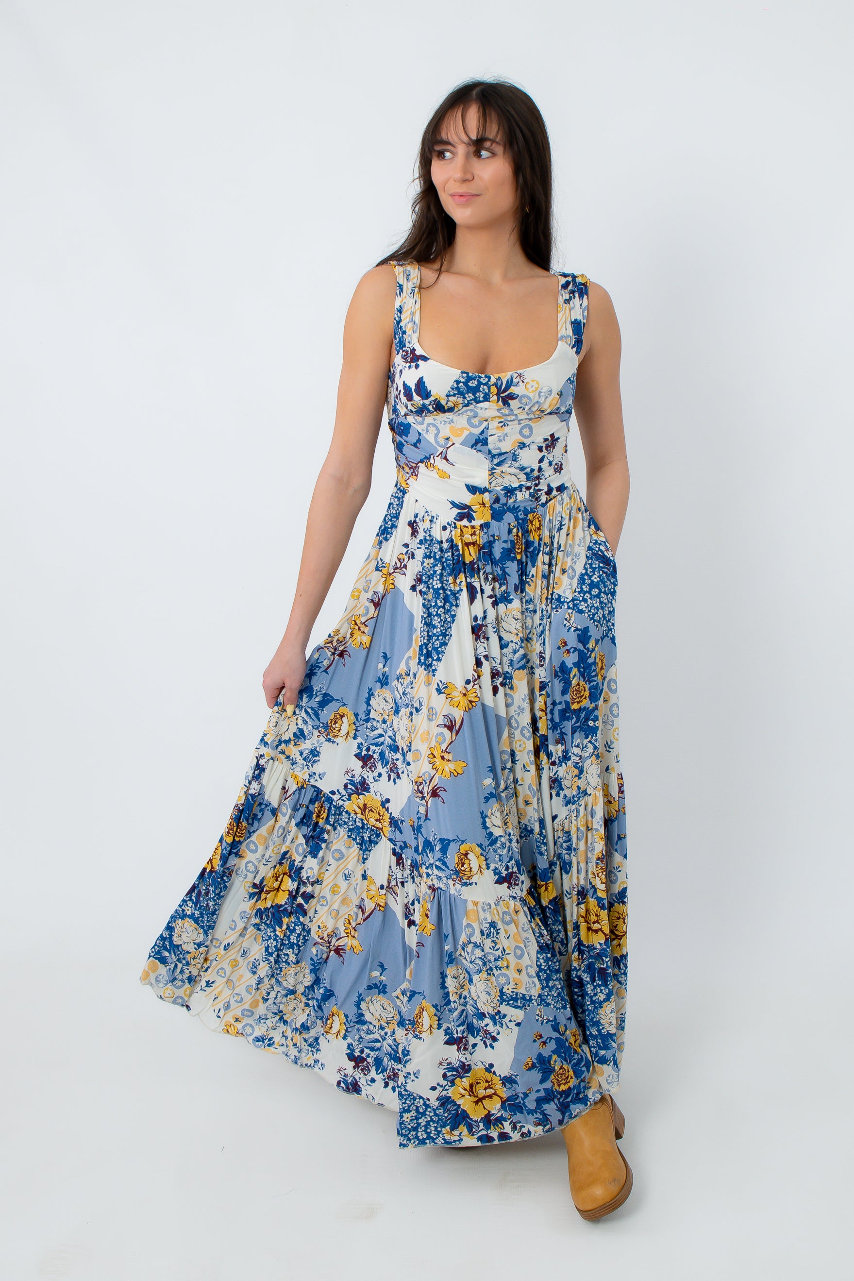 Side view of boho floral maxi dress with tiered skirt and pockets