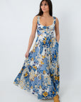 Side view of boho floral maxi dress with tiered skirt and pockets