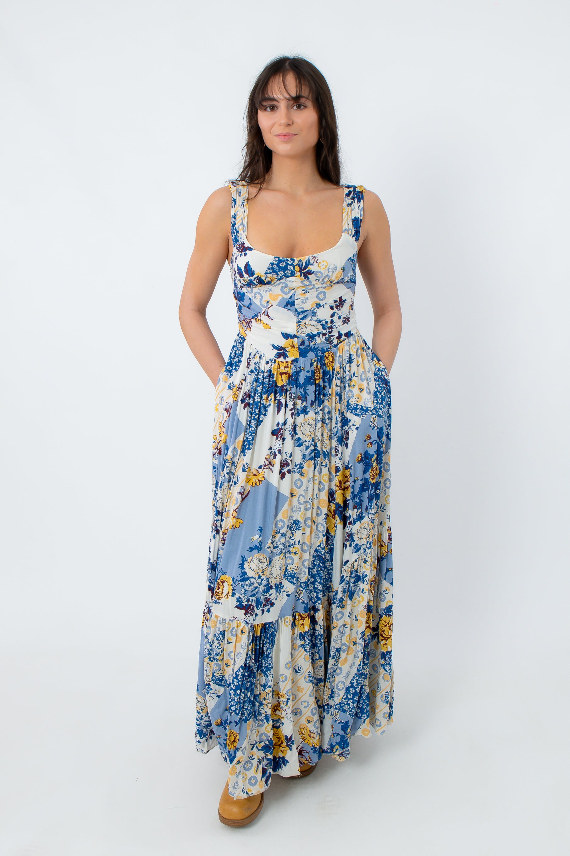 Model wearing boho floral maxi dress with pockets and flowy skirt