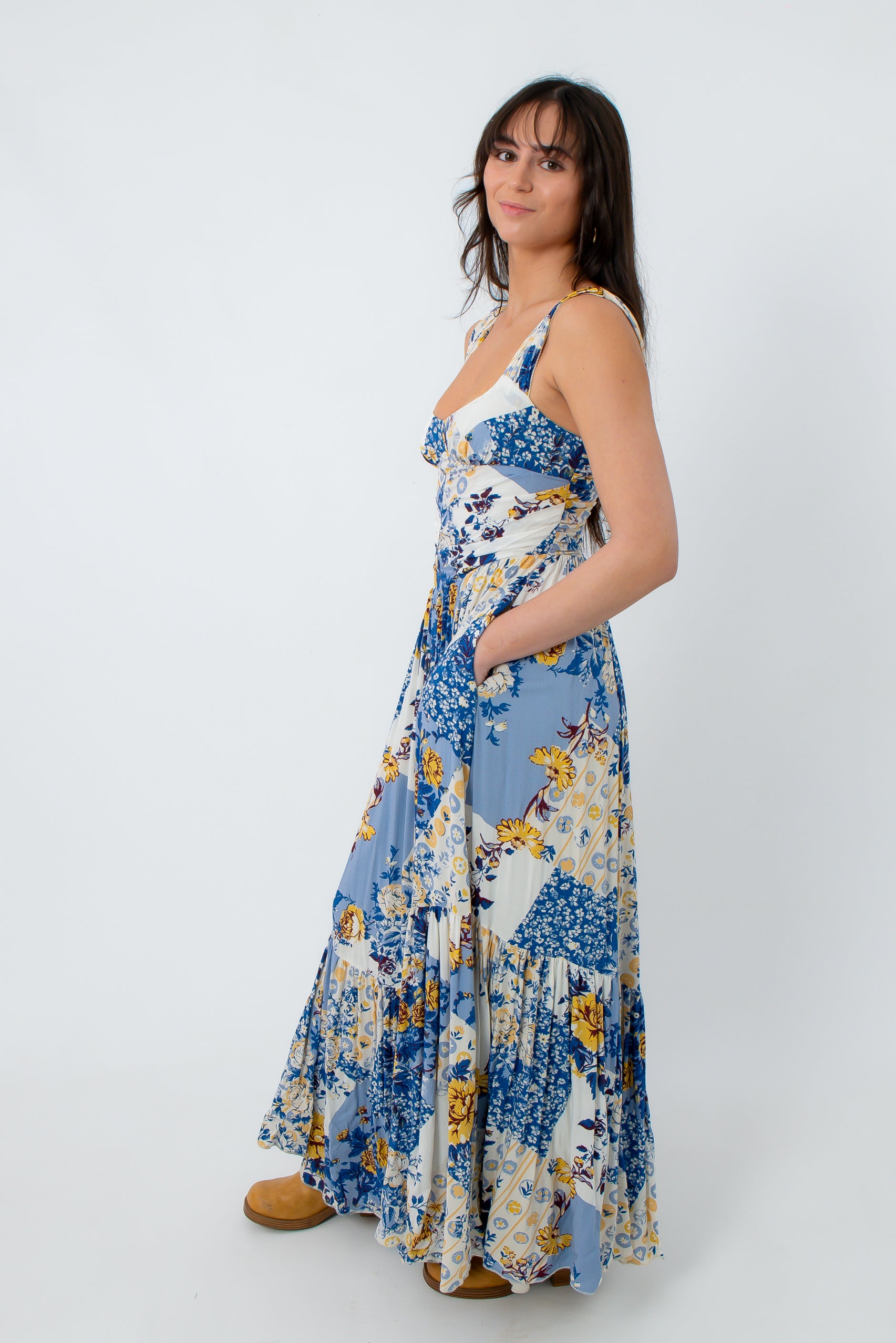 Back view of floral maxi dress with smocked waist and wide straps