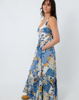 Back view of floral maxi dress with smocked waist and wide straps