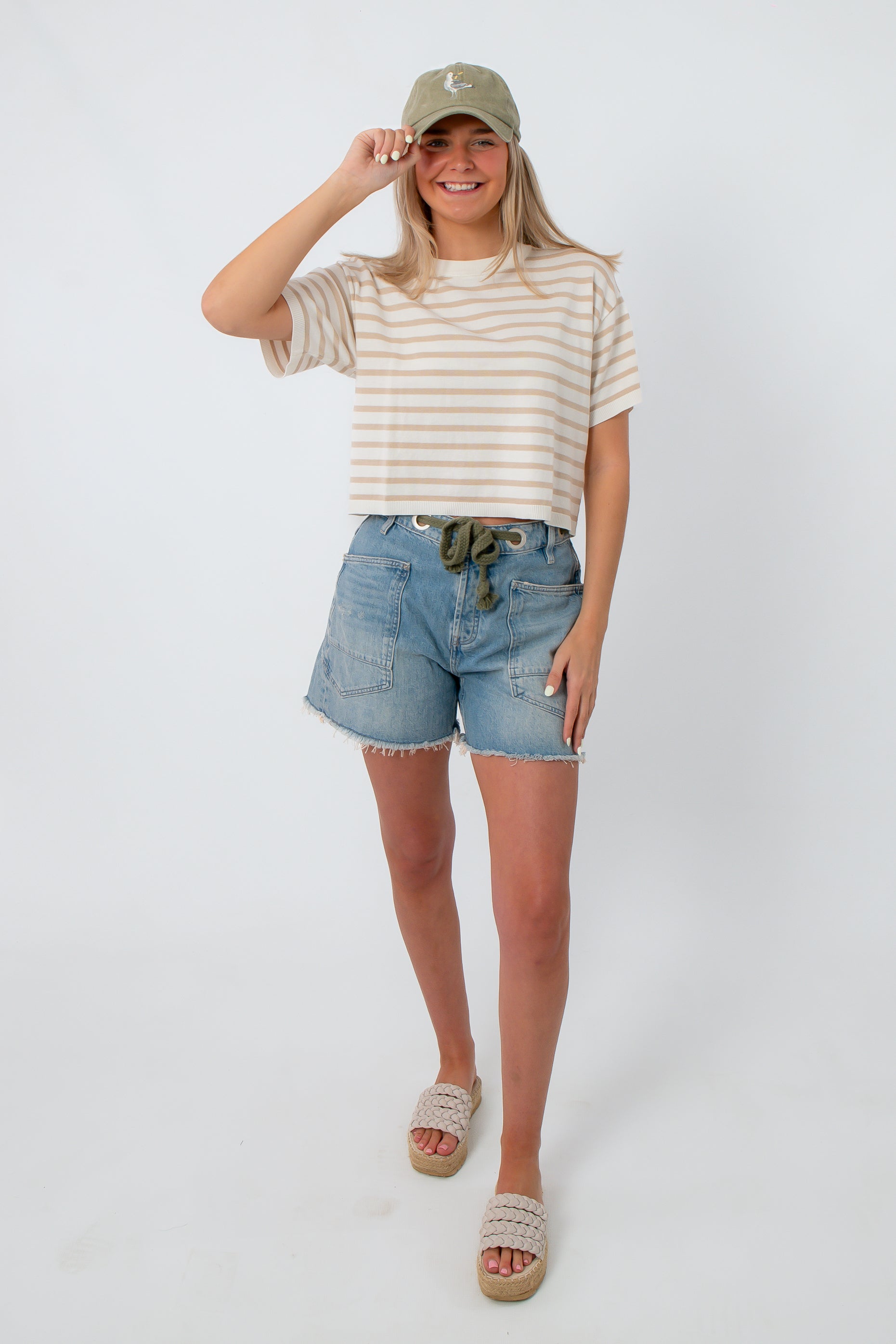 Women wearing striped knit tee, casual summer outfit