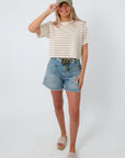 Women wearing striped knit tee, casual summer outfit