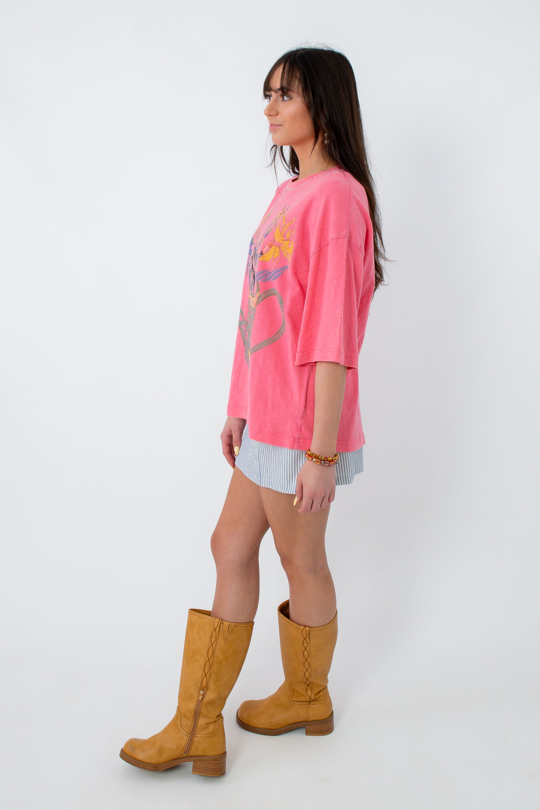 Side view of pink graphic T-shirt with relaxed fit and short sleeves