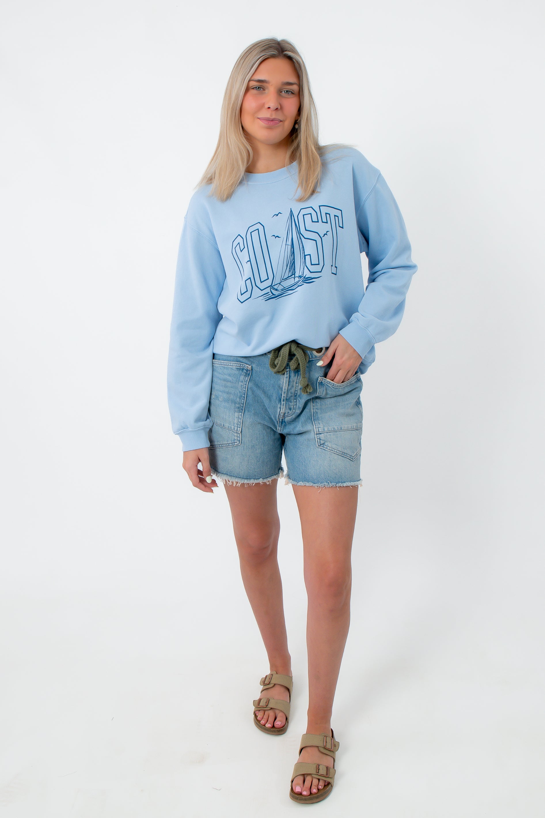 Light blue oversized crewneck sweatshirt with 'Coast' and sailboat graphic, casual women's fashion