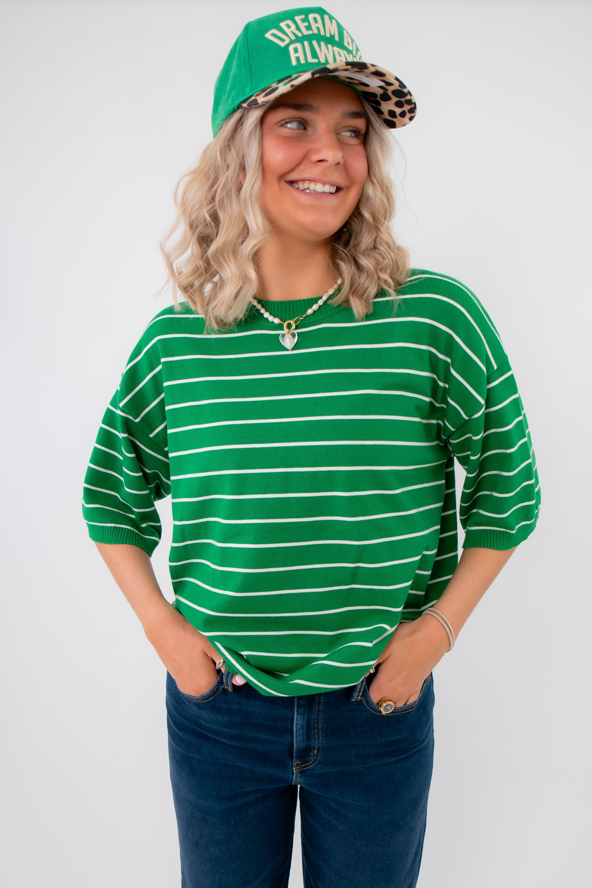 Gwen Green Striped Top – Stylish green short sleeve top with drop shoulders and white stripes, perfect for layering or casual outfits.