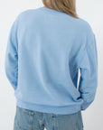 Light blue oversized crewneck sweatshirt from the back