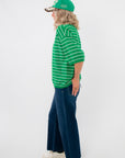 Gwen Green Striped Top – Side view of boxy fit green striped tee, ideal for relaxed styling with wide-leg jeans and casual accessories.