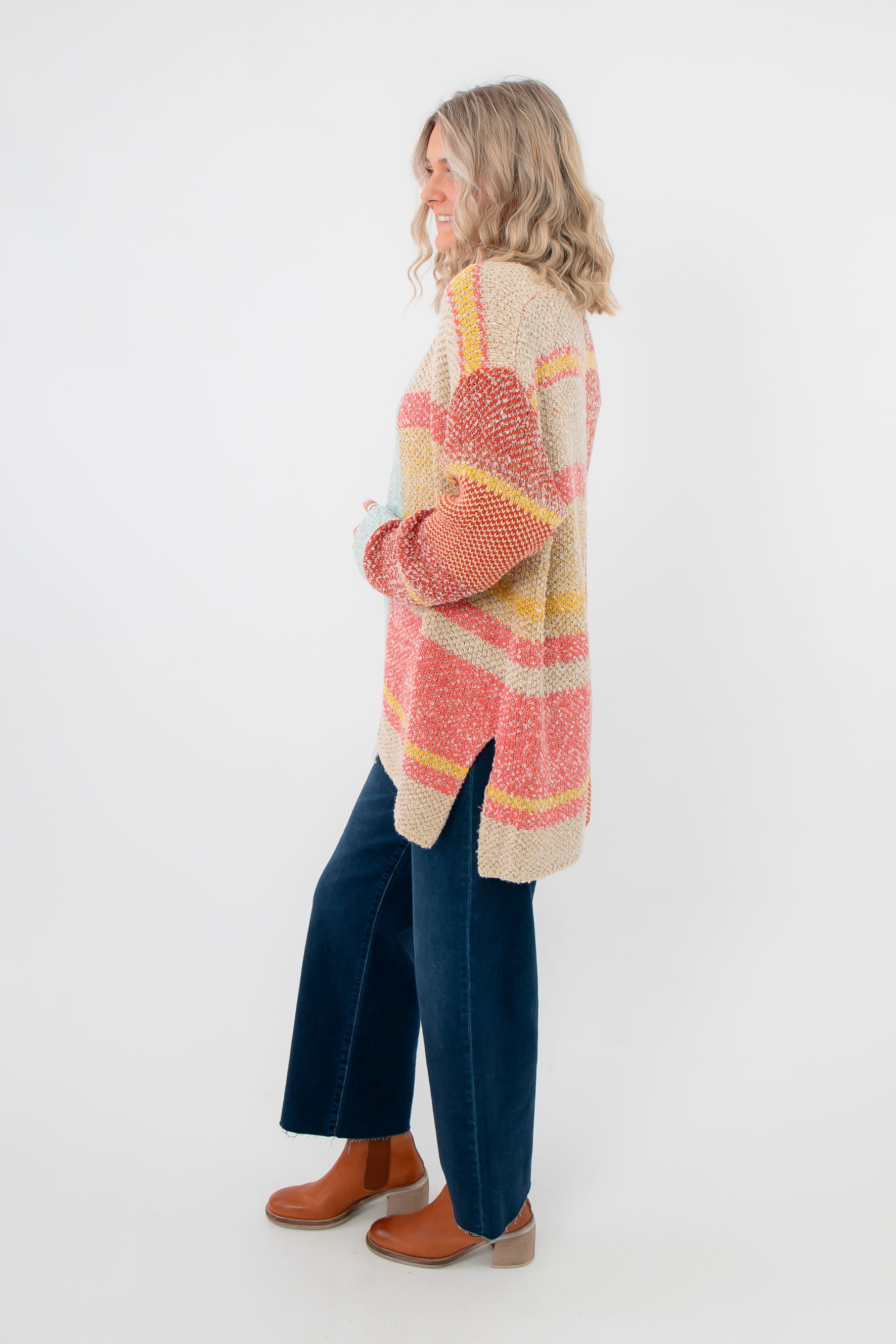 Side view of Iris Orange Stripe Open Cardigan – Cozy oversized fit with bold orange, yellow, and beige stripes, perfect for spring layering.