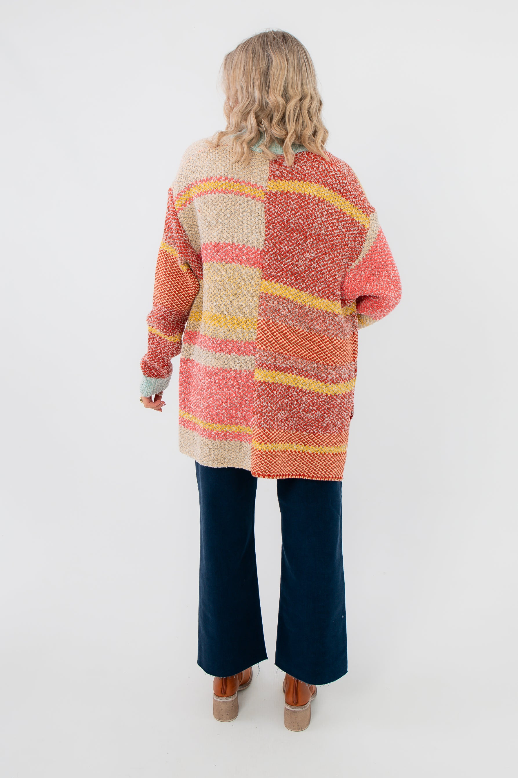 Back view of Iris Orange Stripe Open Cardigan – Features colorful horizontal stripes and relaxed silhouette for a casual, stylish outerwear look.