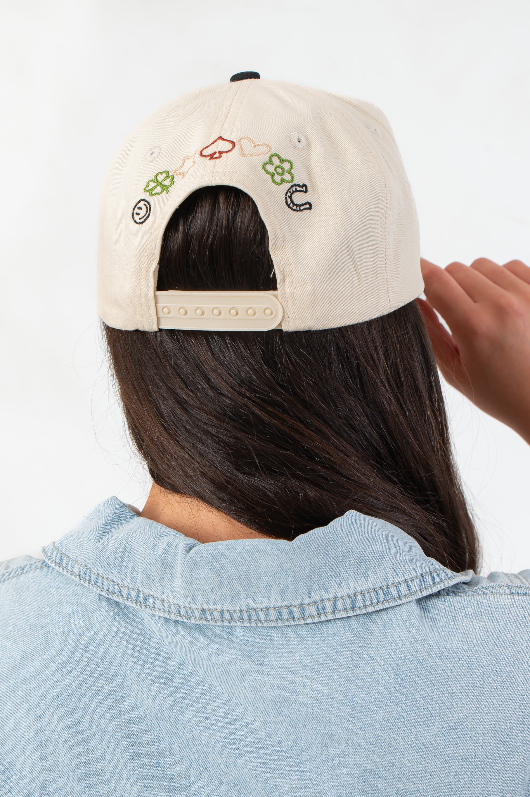 Back view of Good Days on My Mind Pattern Play Canvas Trucker Hat featuring adjustable snap closure and playful embroidered icons.