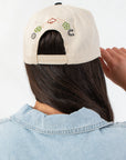 Back view of Good Days on My Mind Pattern Play Canvas Trucker Hat featuring adjustable snap closure and playful embroidered icons.