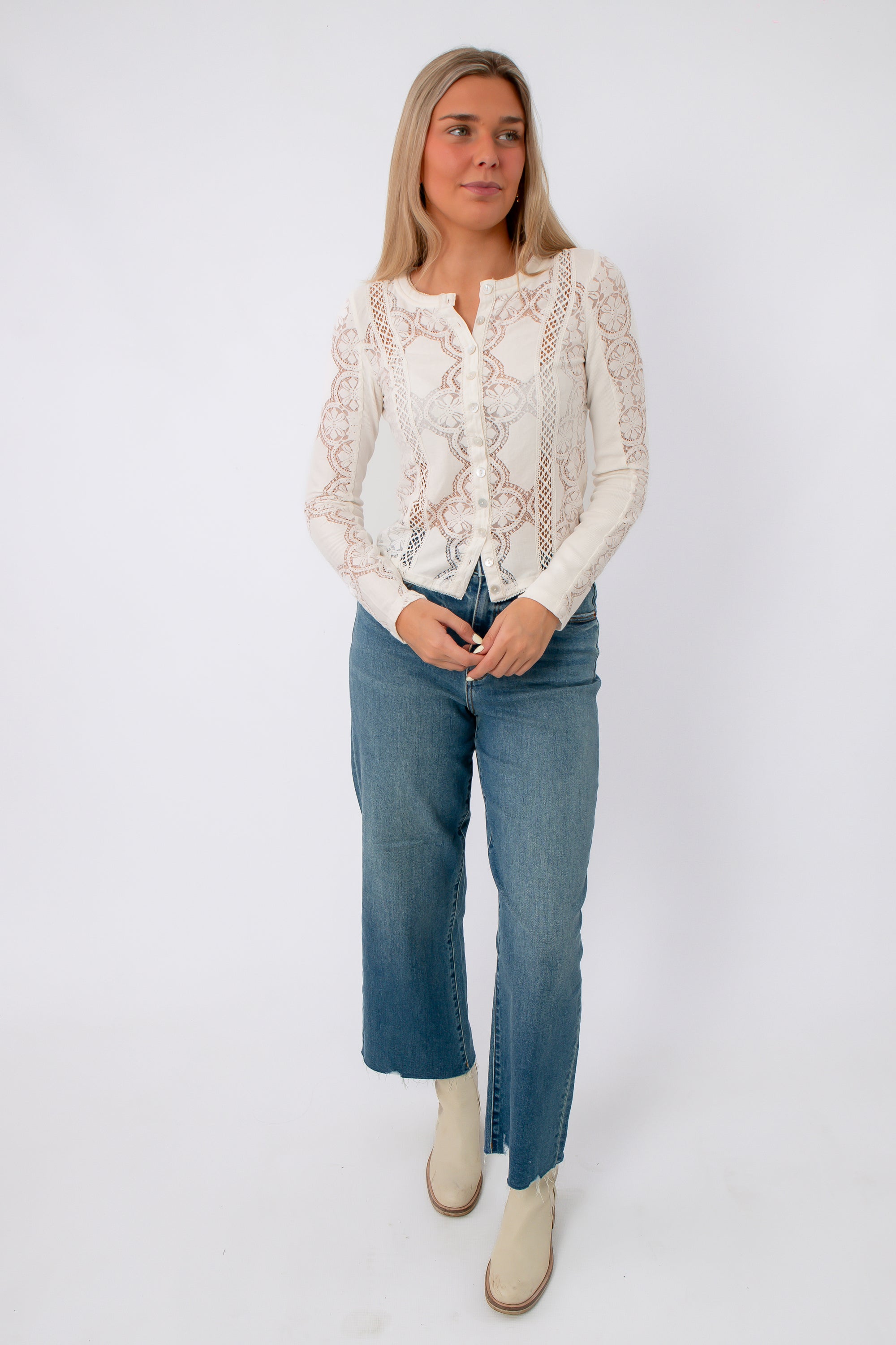 White lace long sleeve blouse with intricate embroidery and button front