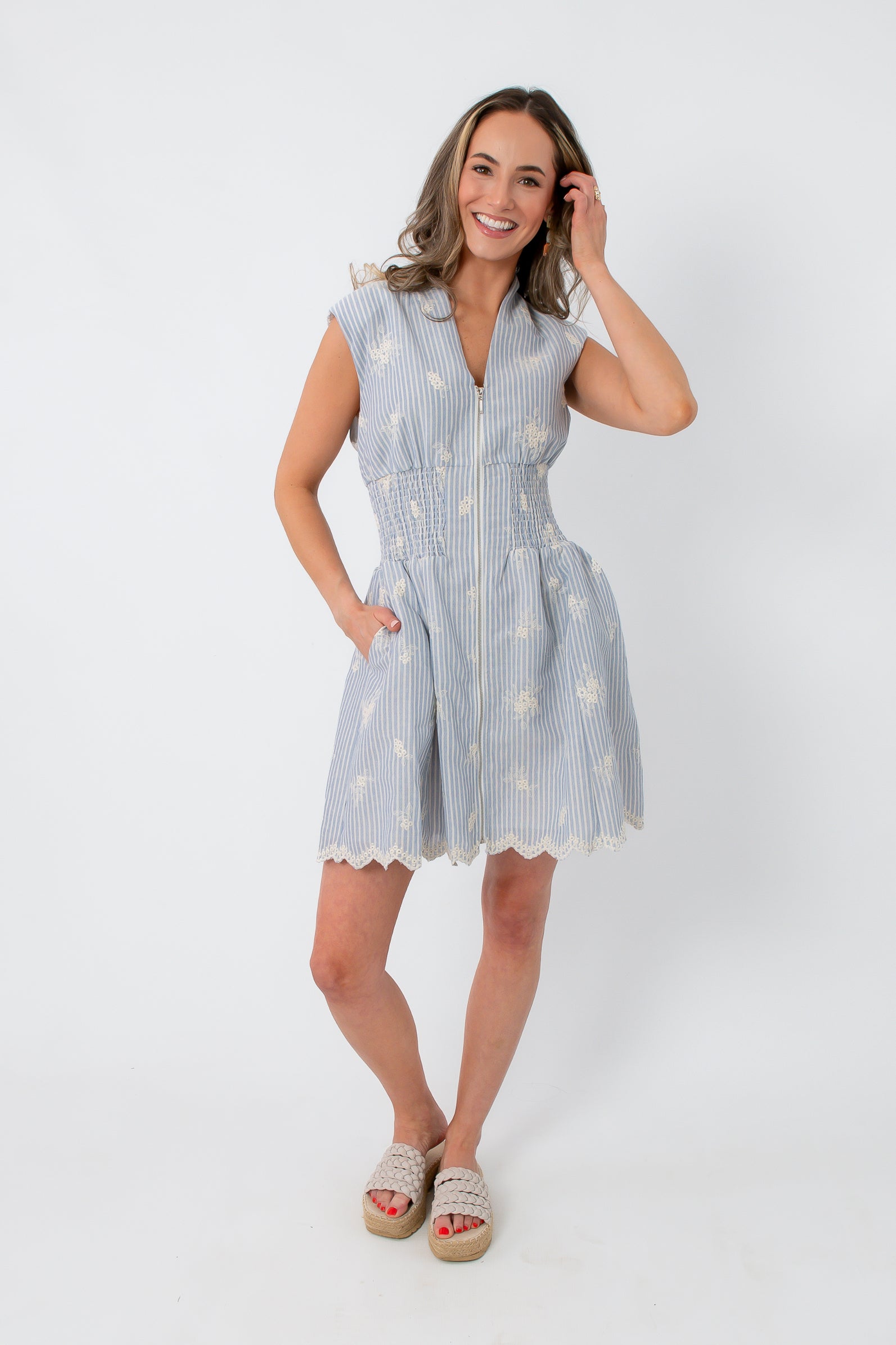 Blue and white embroidered dress with smocked waist and scalloped hem