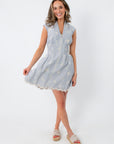 Blue and white embroidered mini dress with zip front and scalloped hem