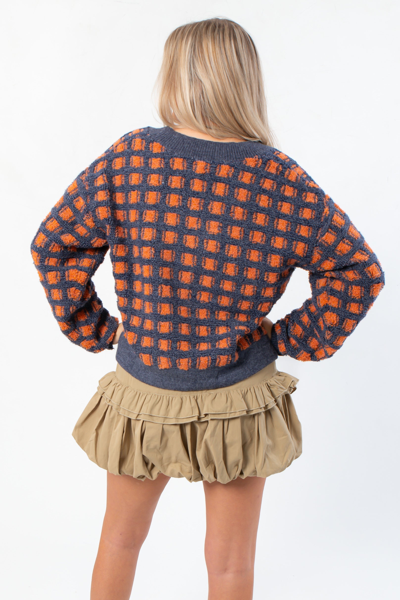 Back view of Blue Ridge Plaid Checkered Cardigan showing navy and orange plaid knit design, ideal for cozy fall outfits.