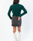 Back view of Daze Spade Malibu Mid Waist Mini Skirt featuring classic denim pockets and a clean hemline for a modern mini look.