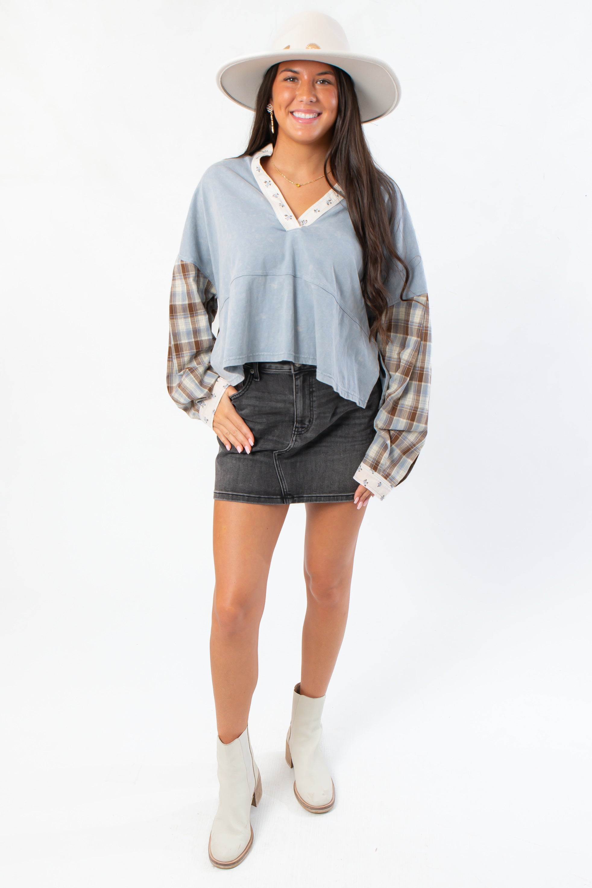 Boho-inspired Everyday Ease Denim Patchwork Top featuring mixed fabrics and relaxed fit, paired with black denim skirt and ankle boots.