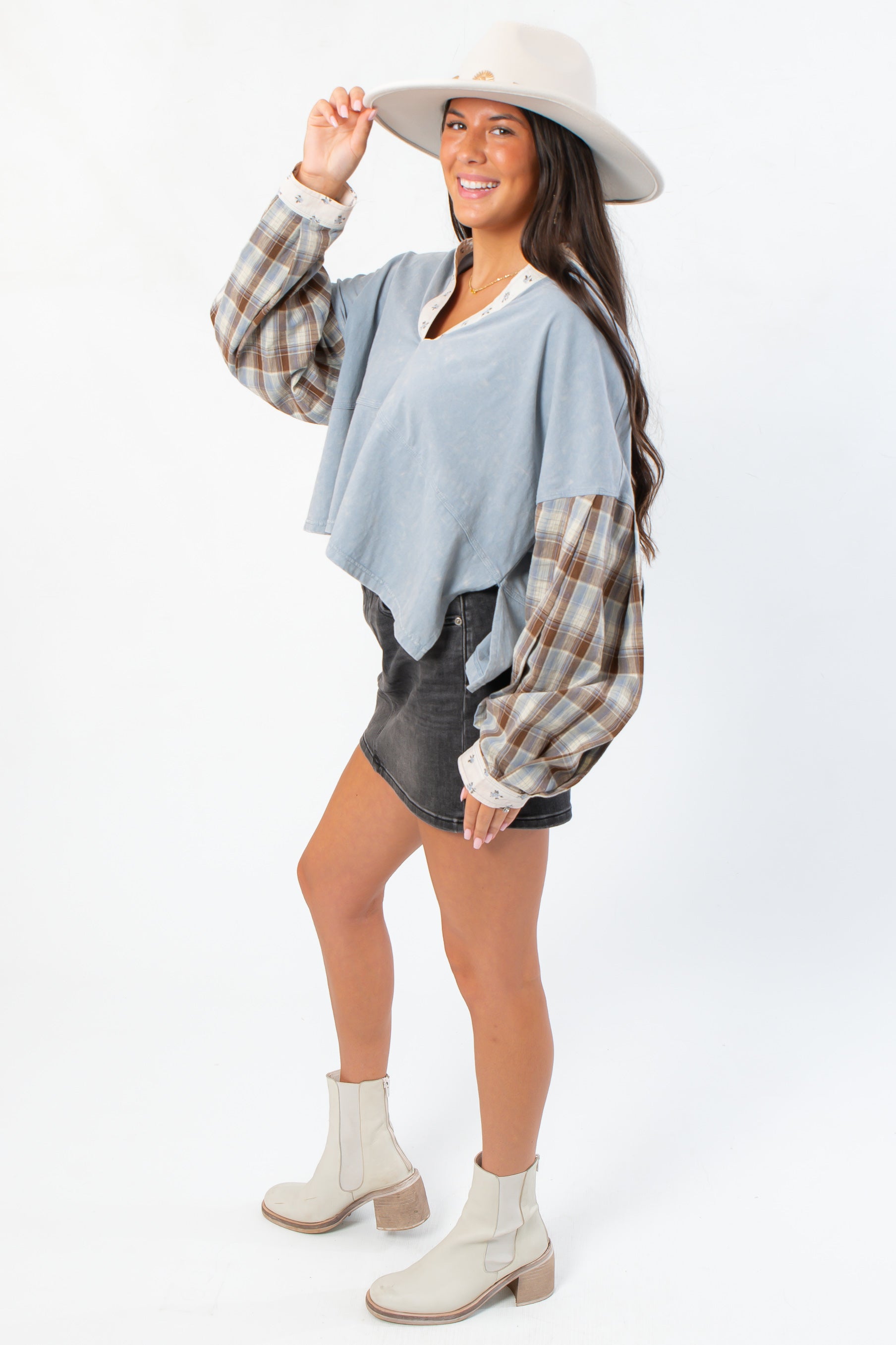 Side view of Everyday Ease Patchwork Denim Top showing flowy silhouette and plaid sleeve detail, ideal for cozy fall layering.