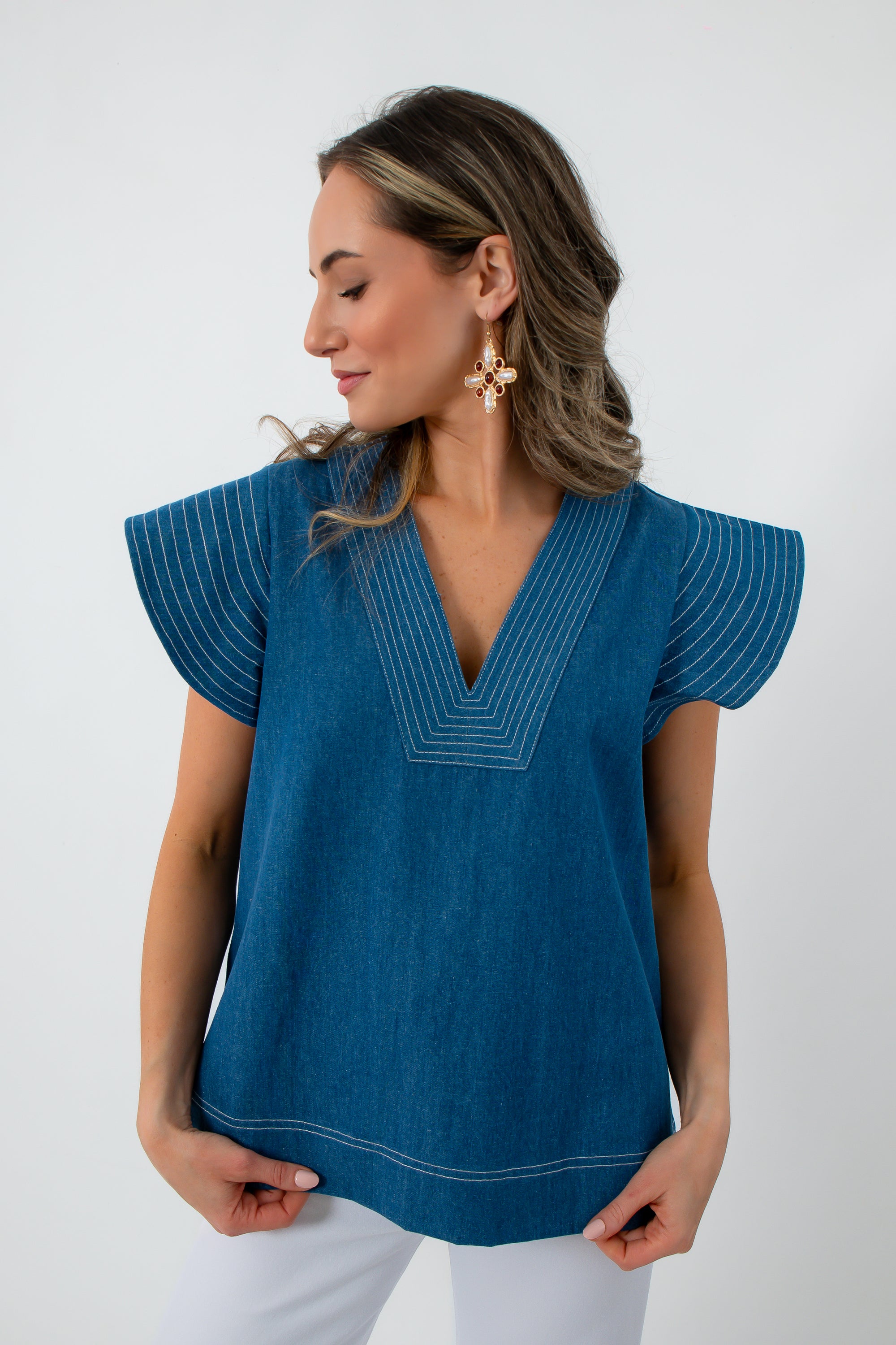 Back view of denim twill blue short sleeve blouse with contrast stitching, women's fashion top