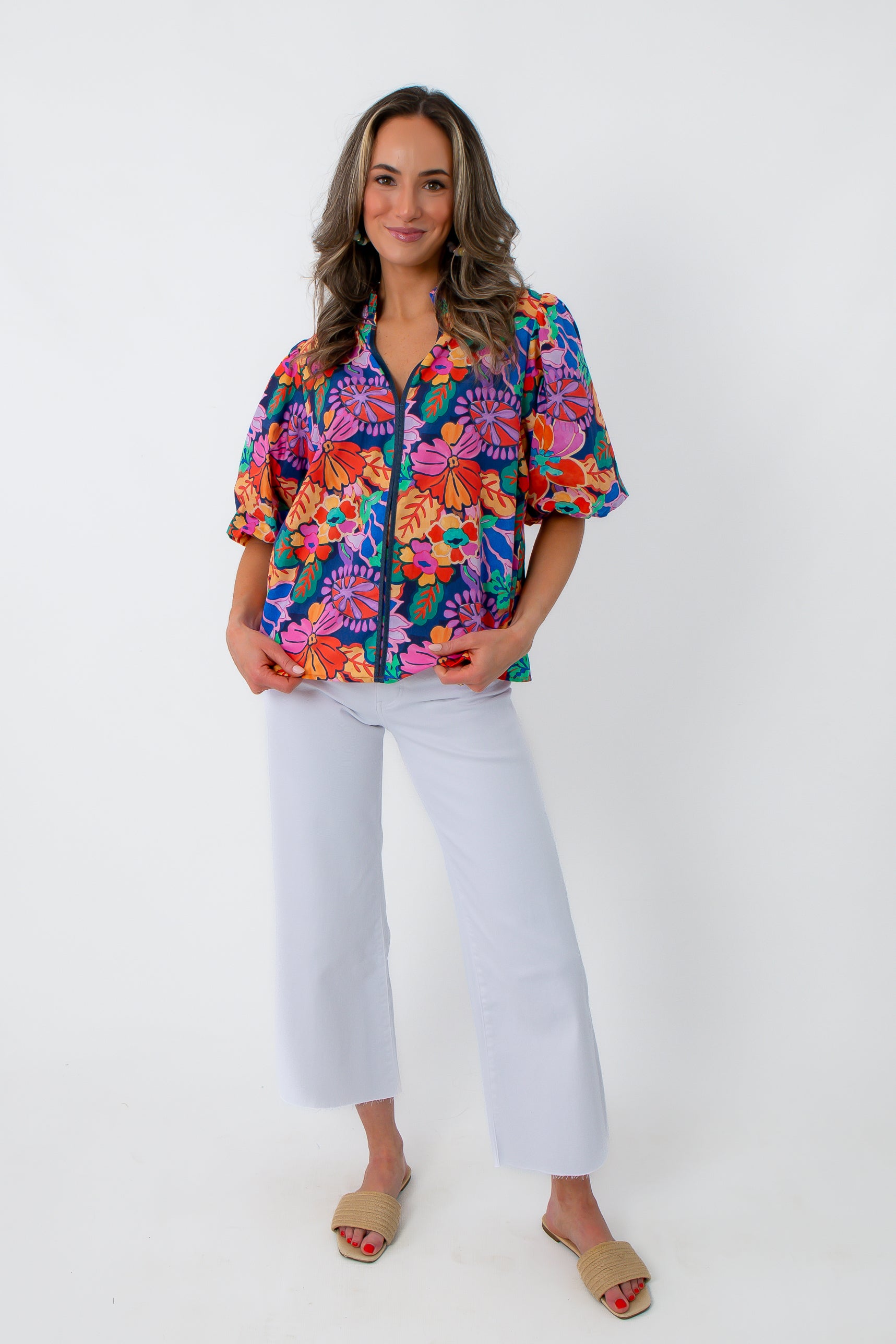 Vibrant floral blouse with puff sleeves and zip closure
