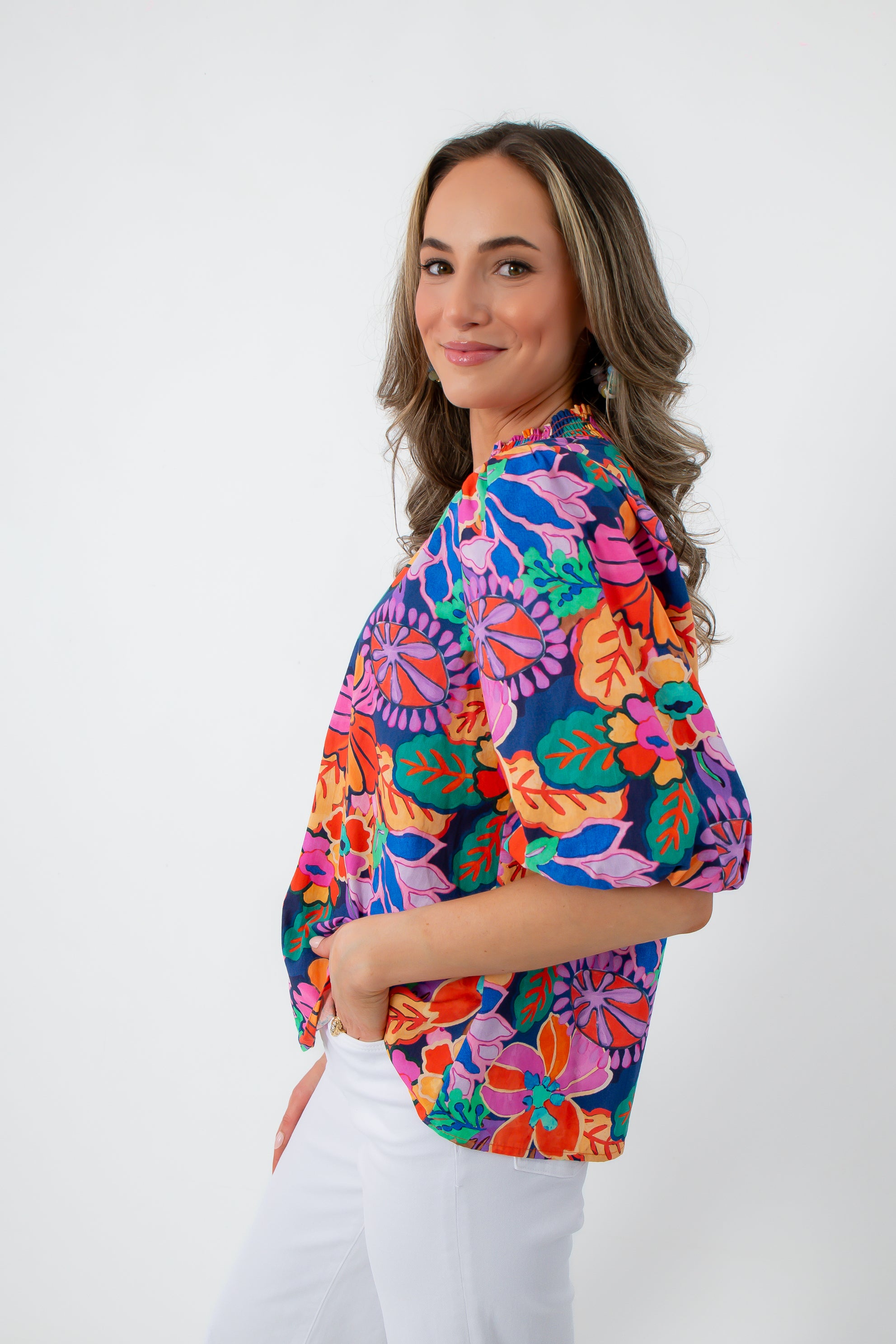 Back view of colorful floral blouse with puff sleeves