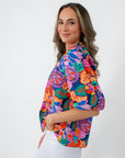 Back view of colorful floral blouse with puff sleeves