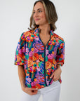 Colorful floral blouse with puff sleeves and zip front
