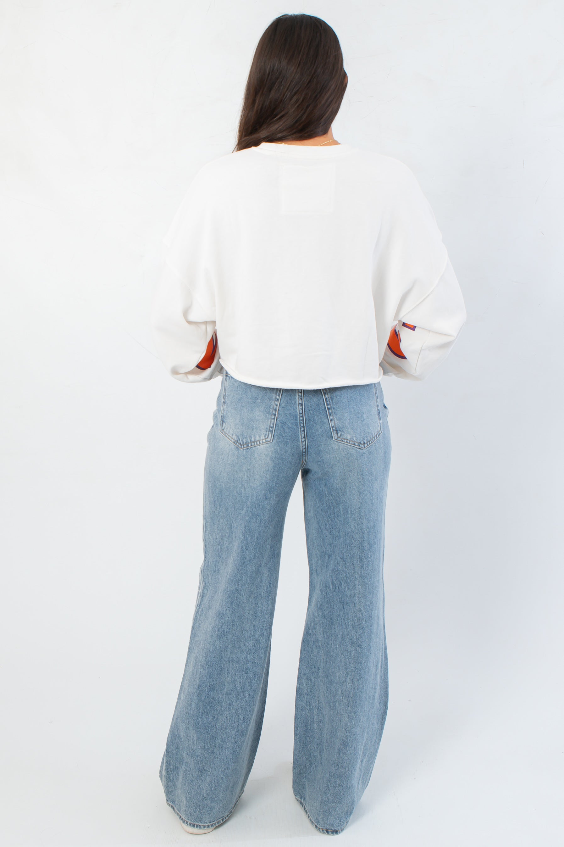 Back view of Clemson Phipps Cropped Long Sleeve Top highlighting its clean, minimal design and cropped silhouette.