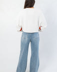 Back view of Clemson Phipps Cropped Long Sleeve Top highlighting its clean, minimal design and cropped silhouette.