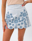 up close details showing the embroidered eyelet pattern