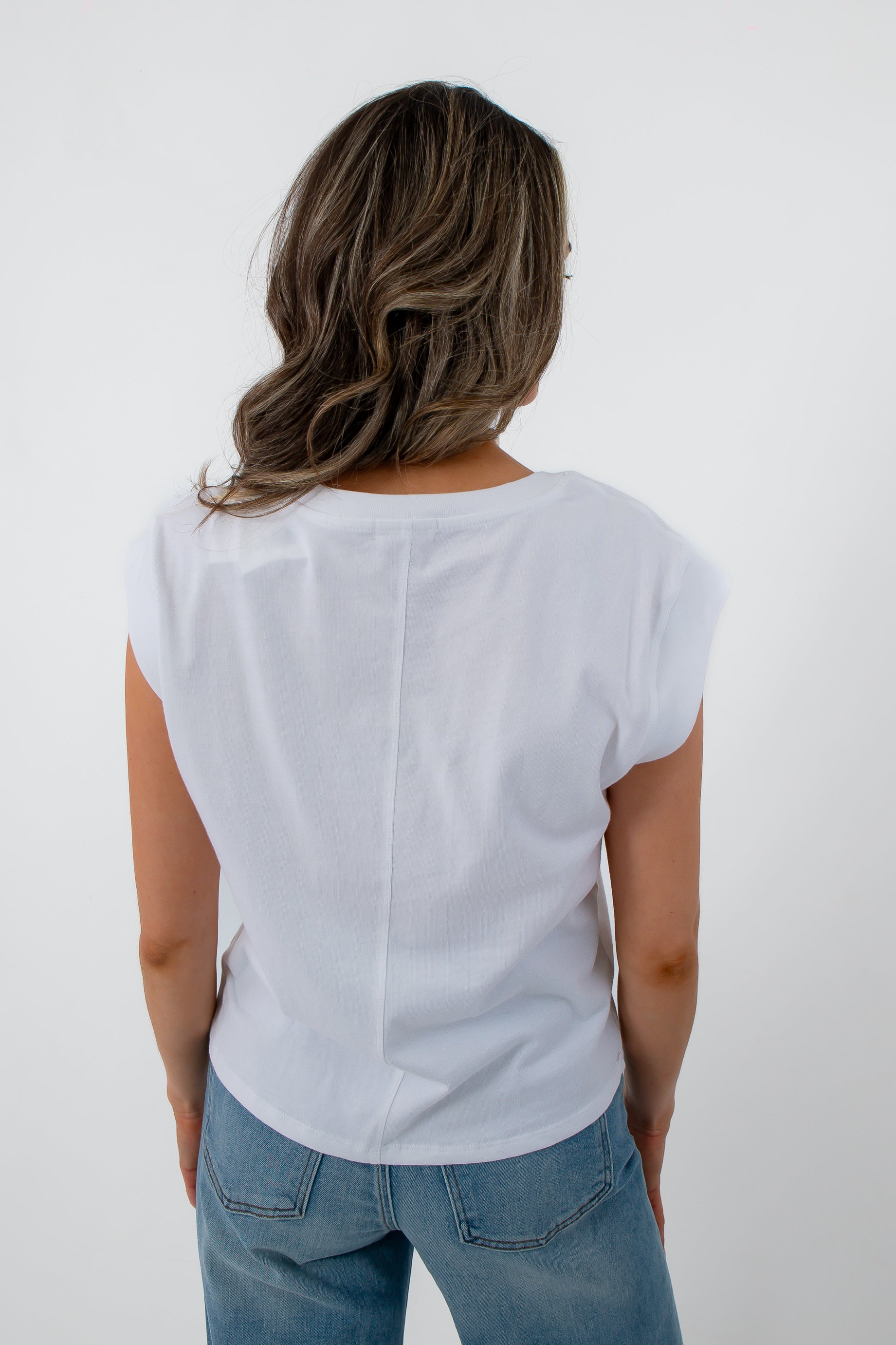 White jersey top for casual layering, back view