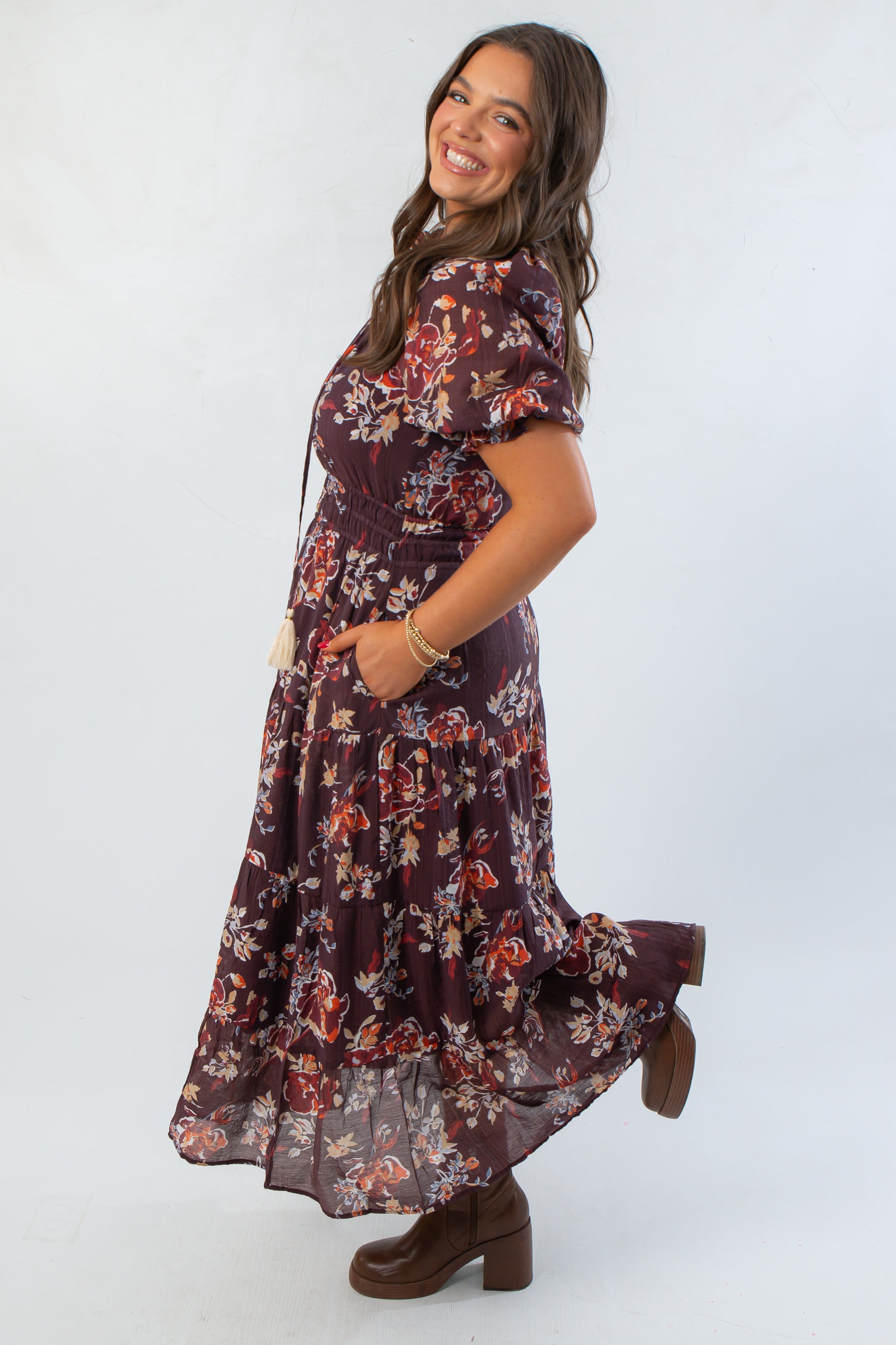 Side view of THML Burgundy Printed Puff Sleeve Tiered Maxi Dress showing flowy silhouette and floral print, perfect for autumn fashion.