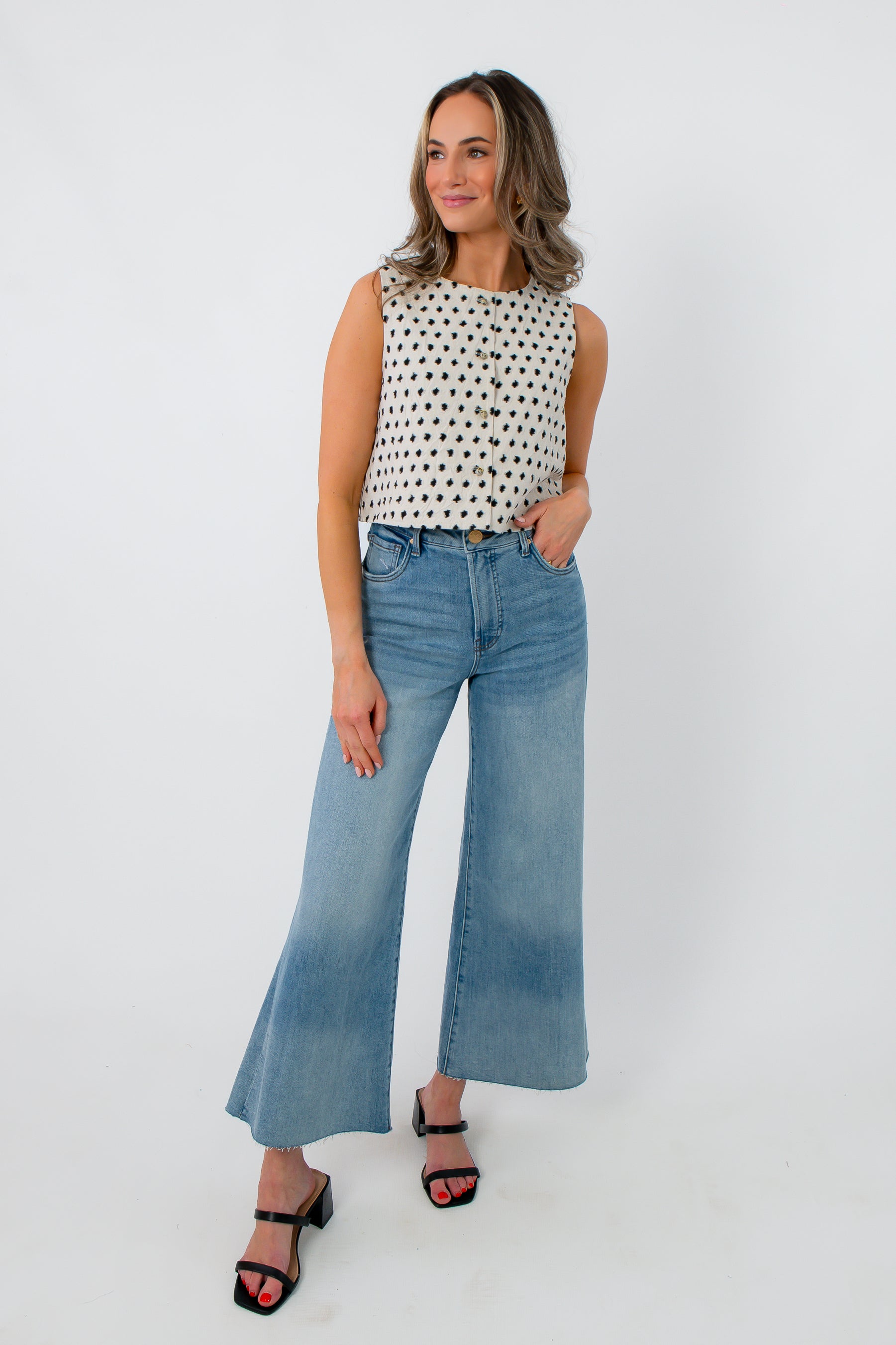 Back view of sleeveless polka dot top for women