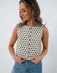 Cream sleeveless knit top with black polka dots for women