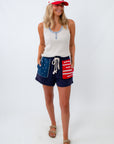 casual henley tank top for jeans and shorts styled with american flag shorts and trucker hat