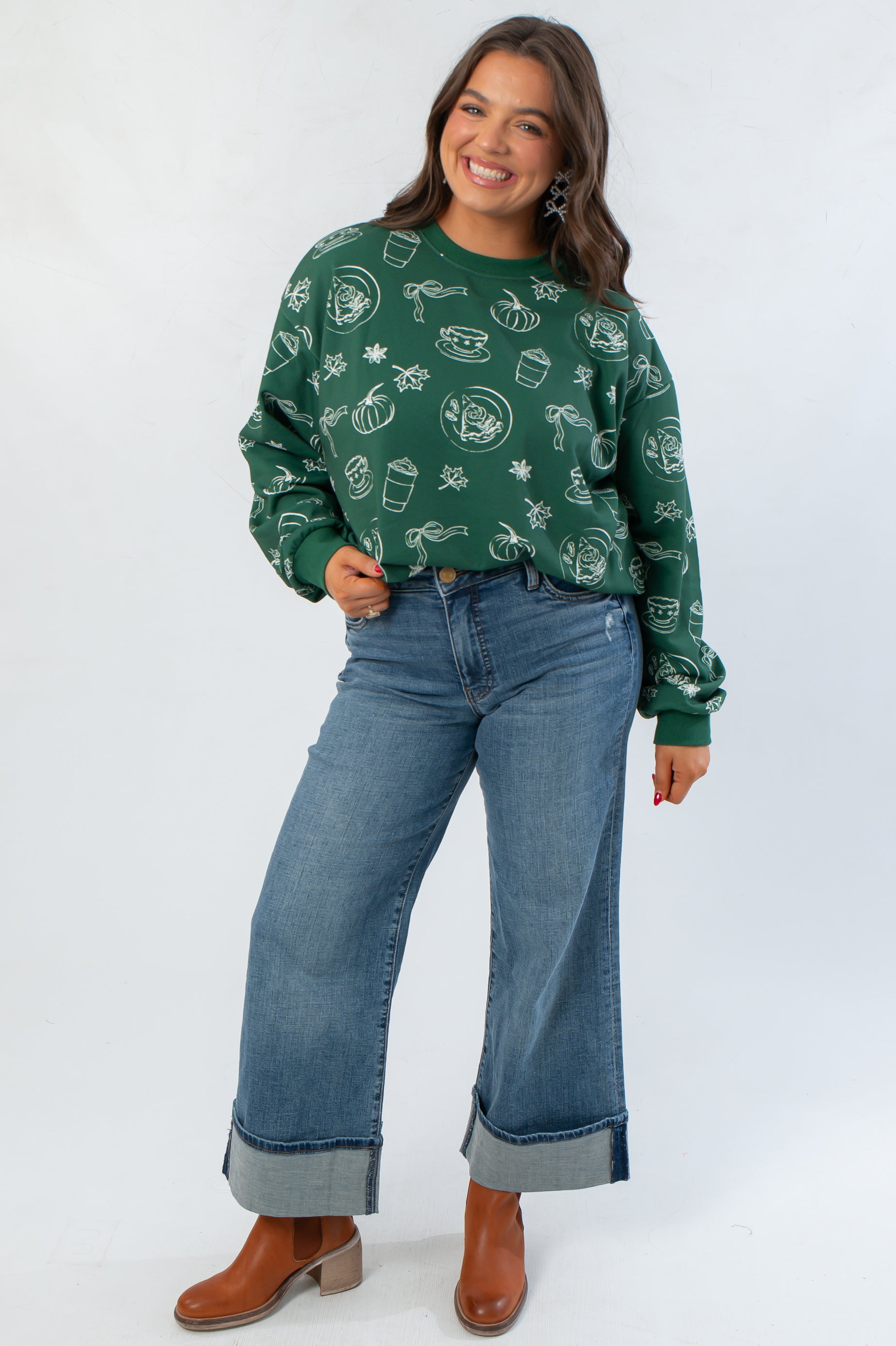 Hunter Green Pumpkin Pie Cutie Pullover Sweatshirt paired with cuffed jeans and boots, showcasing a relaxed fall fashion look.