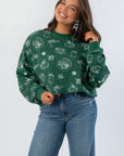 Pumpkin Pie Cutie Hunter Green Pullover Sweatshirt featuring white fall-themed graphics, ideal for a cozy seasonal wardrobe update.