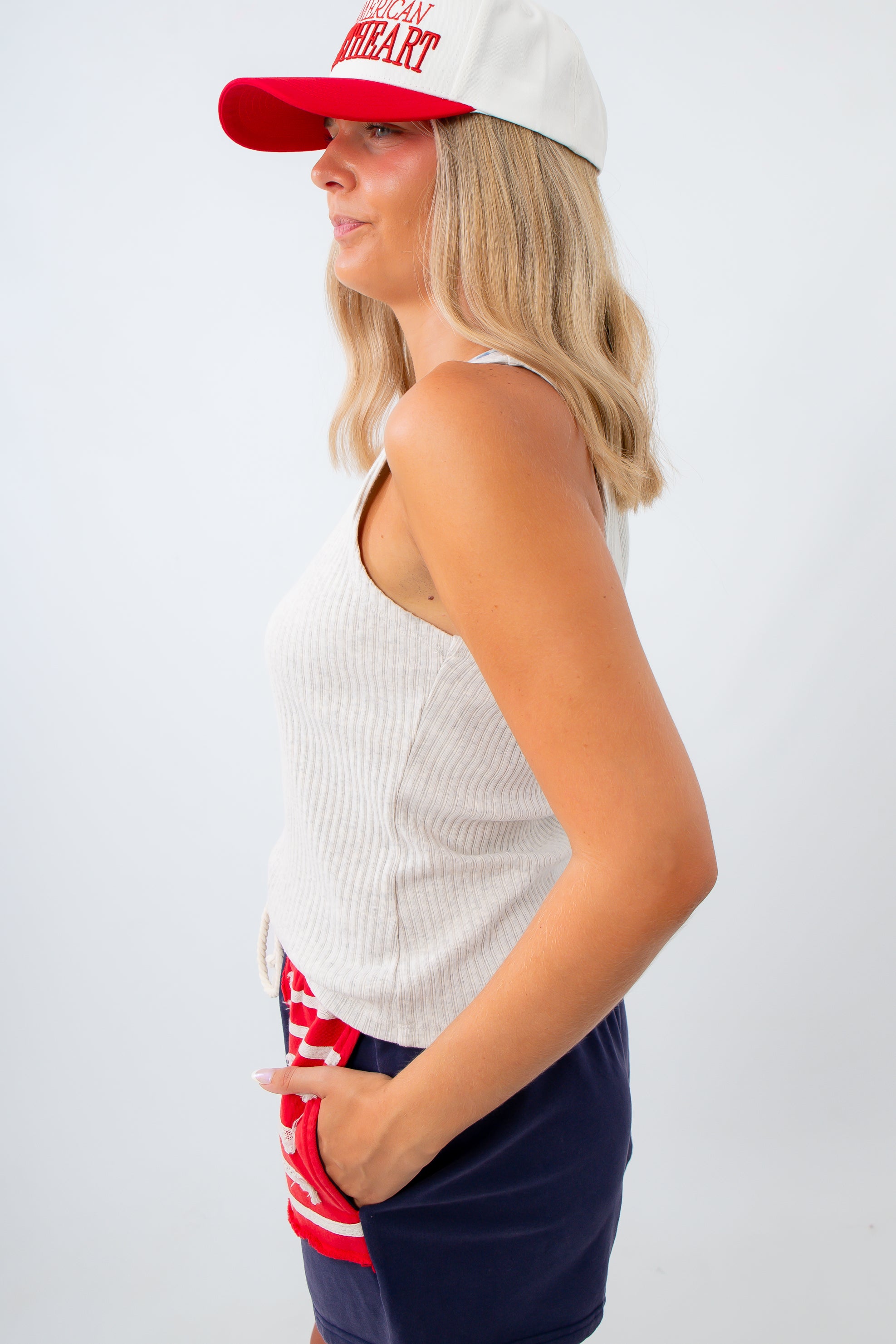 casual henley tank top for jeans and shorts styled with american flag shorts and trucker hat
