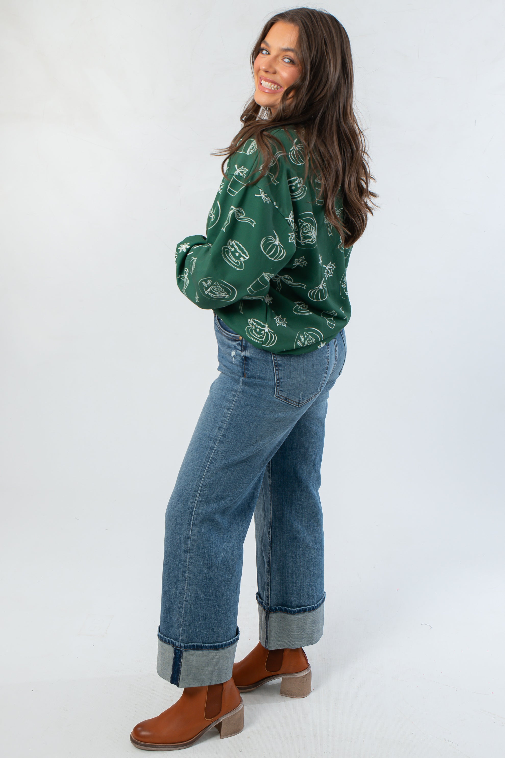 Side view of Pumpkin Pie Cutie Hunter Green Pullover Sweatshirt highlighting its relaxed fit and fall-inspired graphic design.