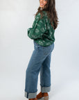 Side view of Pumpkin Pie Cutie Hunter Green Pullover Sweatshirt highlighting its relaxed fit and fall-inspired graphic design.